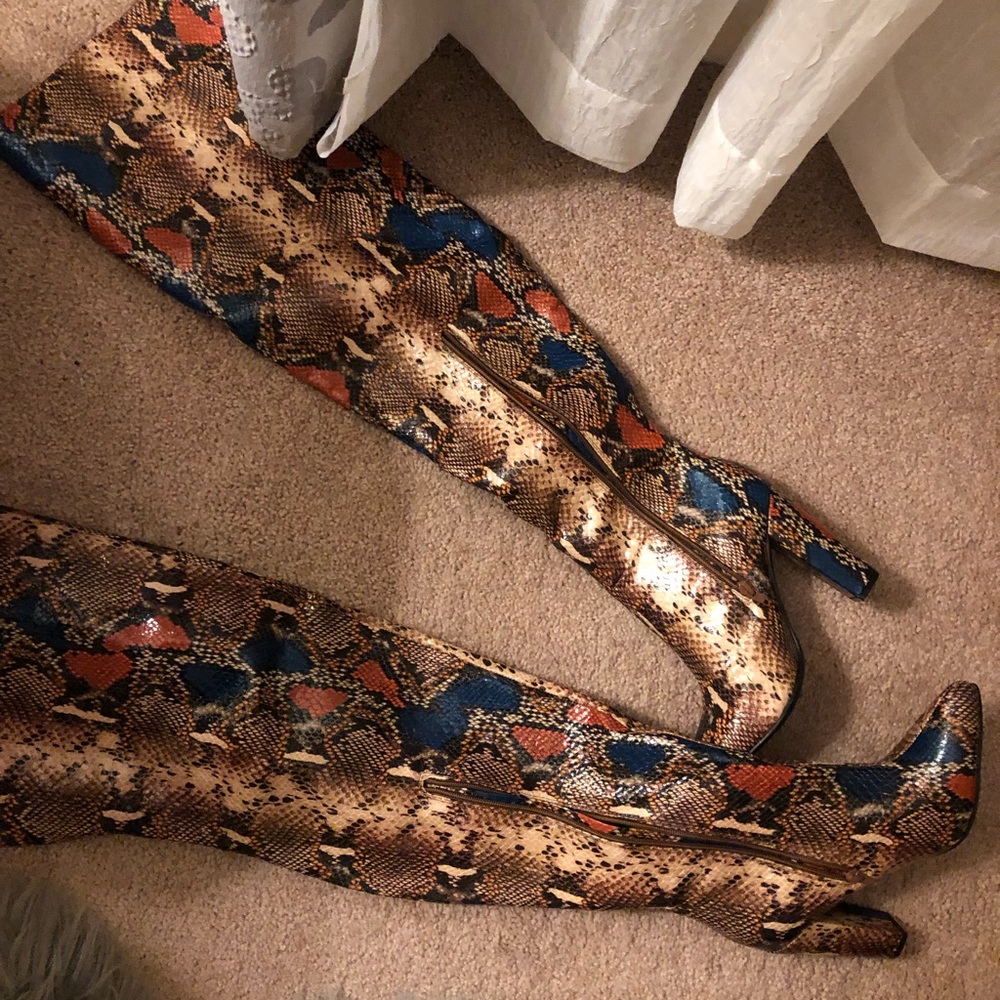 Thigh high colorful snakeskin boot.
